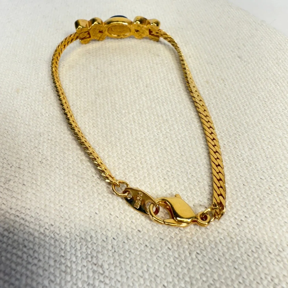 Avon Gold Tone Bracelet with Black Stone and Rhinestone Accents‎ Xs and Os XOX